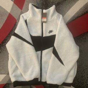 Brand new Nike black swoosh white coat. Size L